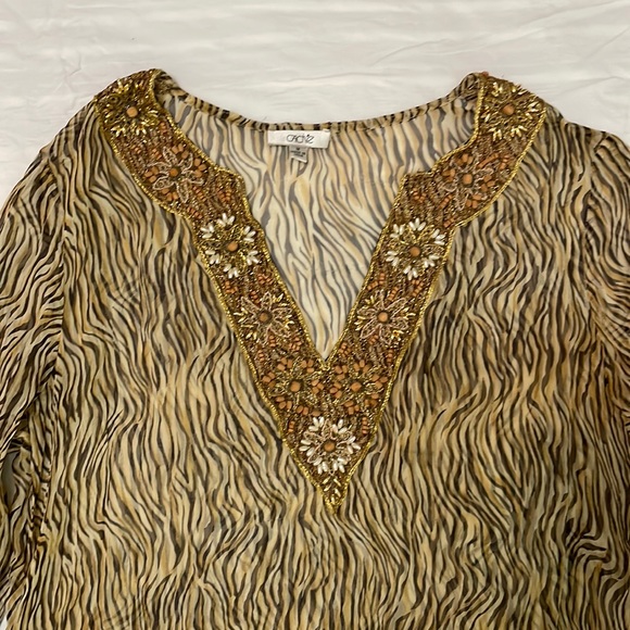 Cache sheer animal print tunic with beautiful beaded detail along v-neck. - Picture 4 of 6